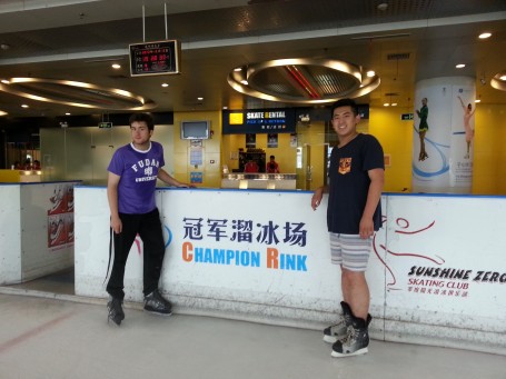 Joshua Neill and Cliff Liu skating at an ice rink by Fudan University