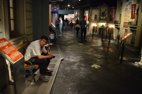 : Cliff is resting on a bench in old Shanghai as part of the museum