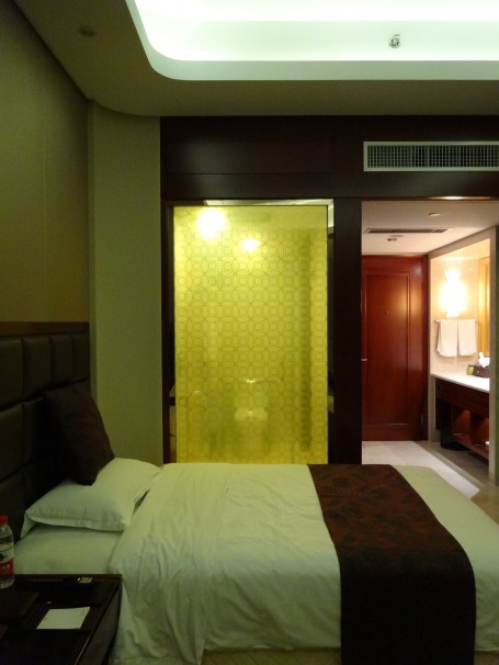 A glass wall between shower and hotel room in Hengdian.