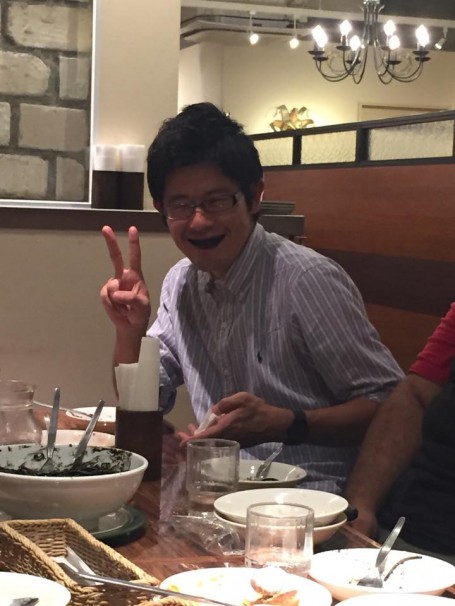 Toku after eating the squid ink pasta during dinner
