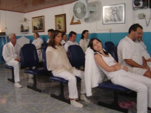 Visitors in white meditate in one of the Casa "current rooms."  Meditation is seen as a central healing modality.  Photo: E. Moore 