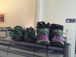 Author's shoes (left). The green and polka dot bows keep shoes from being confused with other shoes in the racks outside dorms.